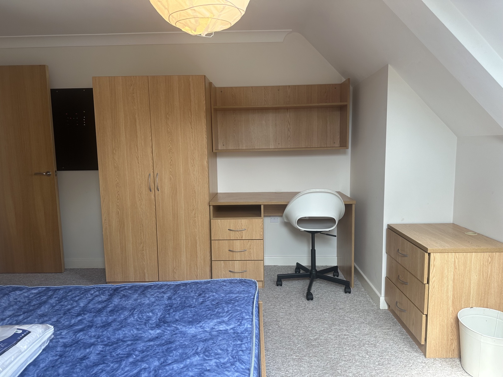 Double bedroom with study desk in a two bedroom apartment at Conel Court
