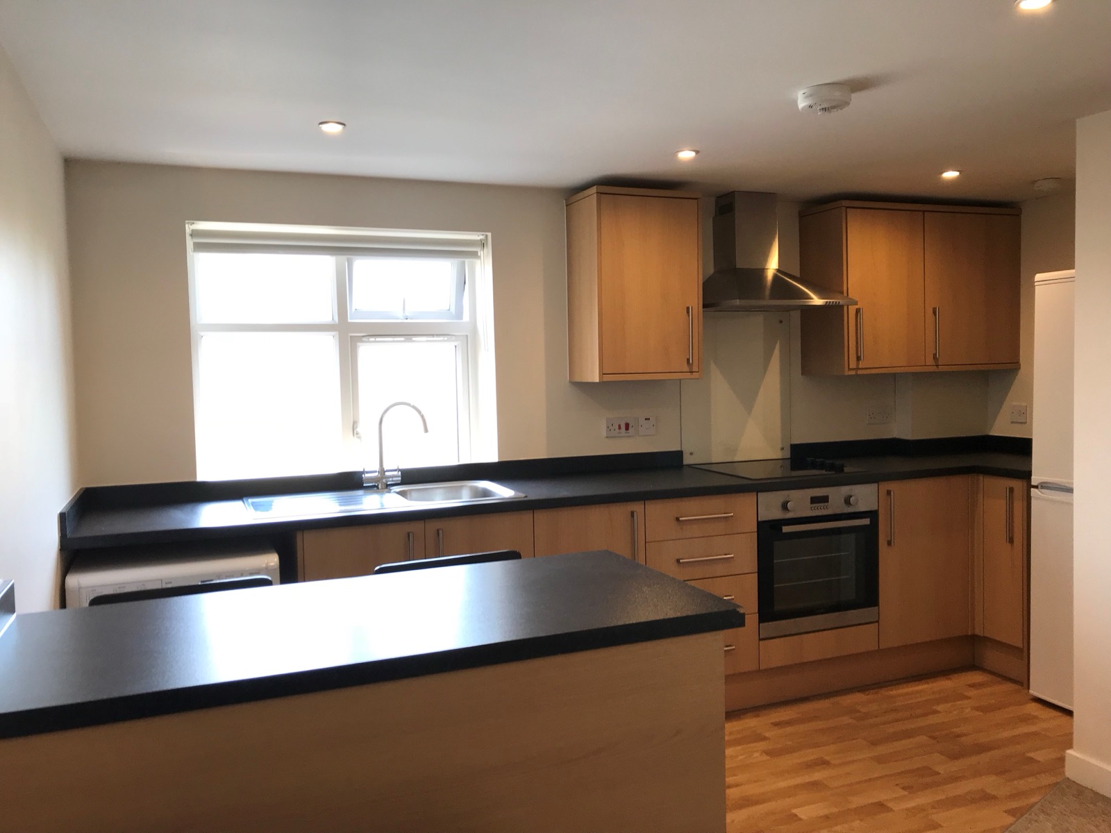 Modern fitted kitchen in a one bedroom apartment at Richmond Court